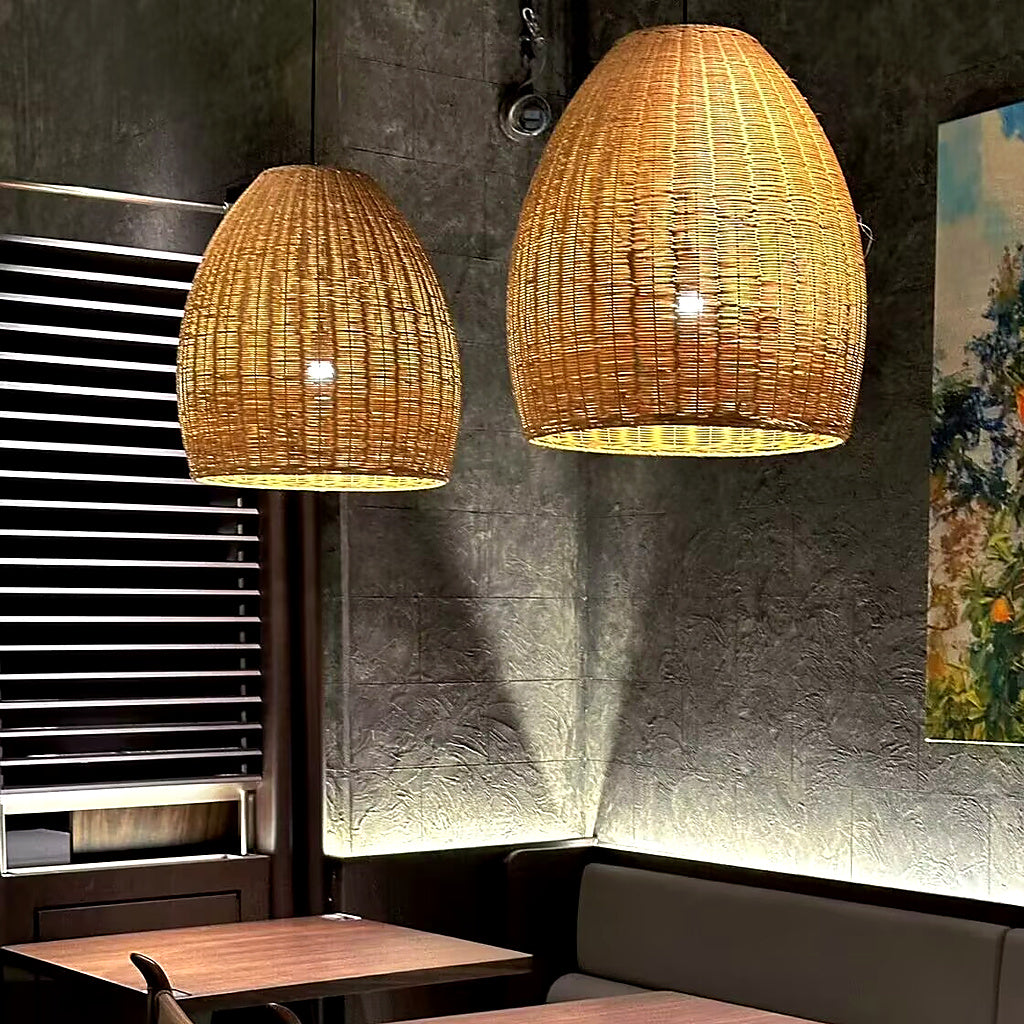 Rattan bell pendant lights with woven conical shades glowing inside