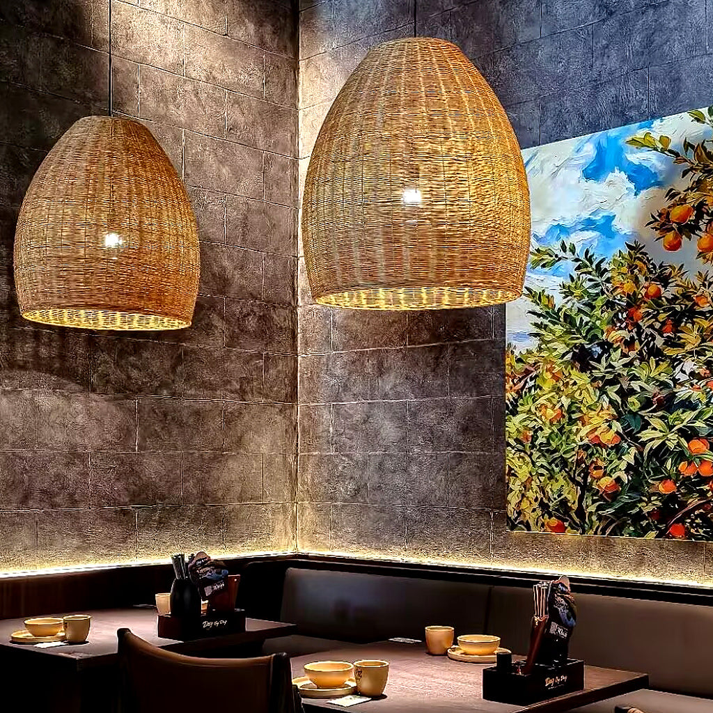 Rattan bell pendant light pair with woven conical shades and warm bulbs