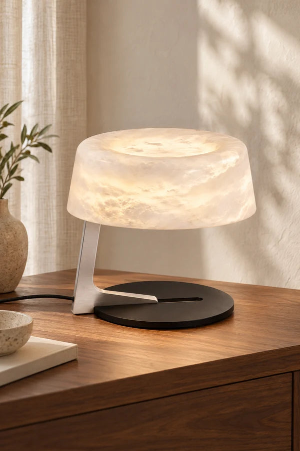 Luma Alabaster Table Lamp on a walnut side table in a warm interior